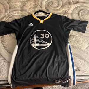 Adidas L Steph Curry jersey.